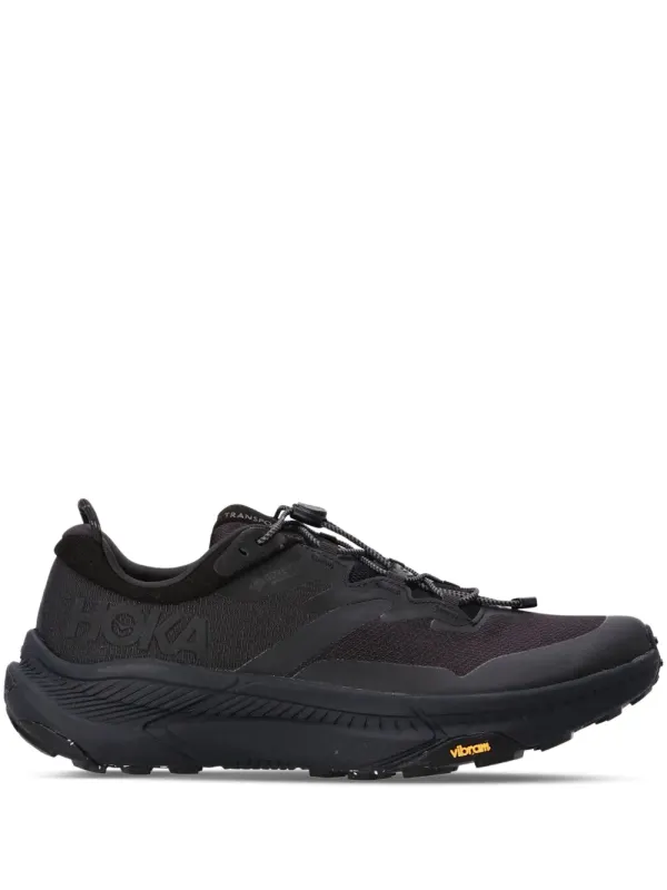 HOKA Transport – Black (1133957F)